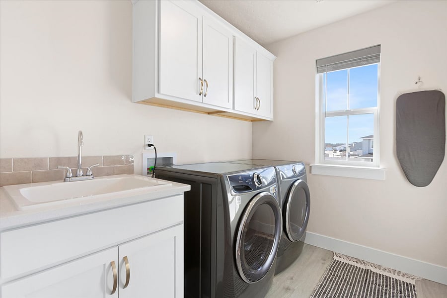 Spacious laundry room located upstairs near the guest bedrooms.