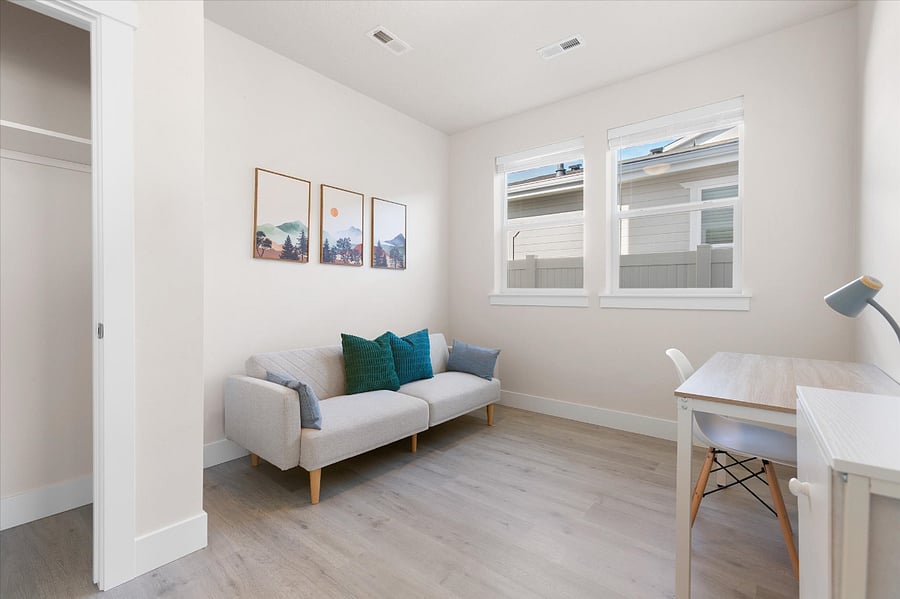 Bedroom 4 is located downstairs beyond the kitchen and features a Twin size futon bed, desk, and closet.  This can be your office, reading room and 4th bedroom!