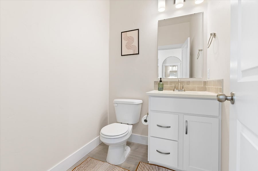 Downstairs half bath, located in the front hallway, between the front door and living room.