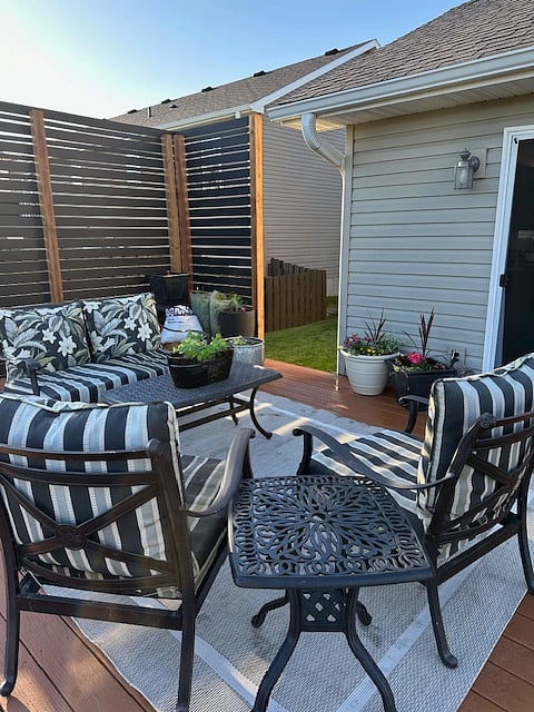 Attractive outdoor sitting area on deck to relax during nice weather days.