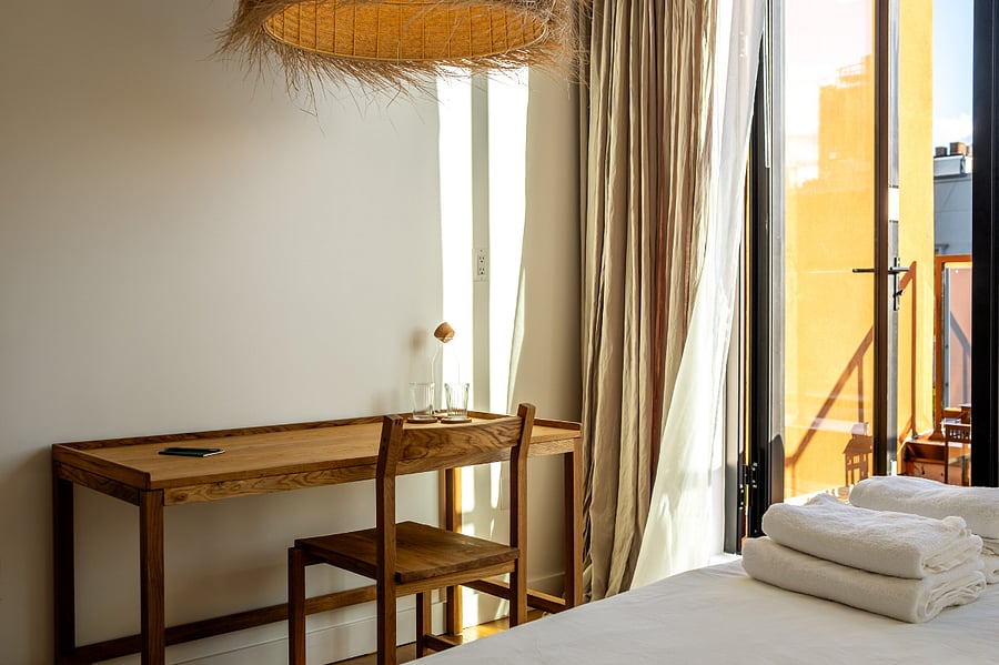 ALONK Suite with ensuite bathroom, private terrace, King bed, wardrobe and dedicated desk.