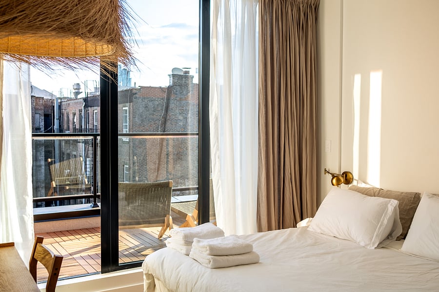 ALONK Suite with ensuite bathroom, private terrace, King bed, wardrobe and dedicated desk.