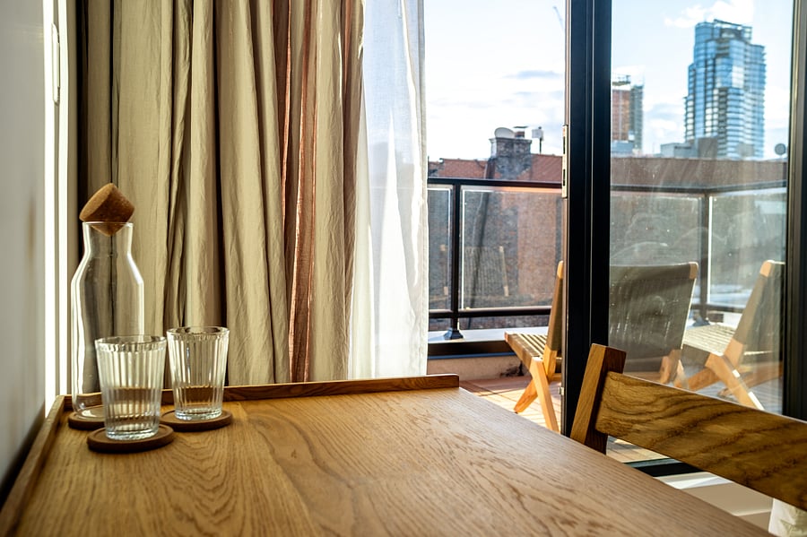 ALONK Suite with ensuite bathroom, private terrace, King bed, wardrobe and dedicated desk.