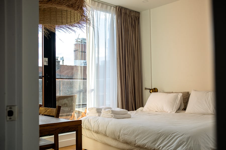 ALONK Suite with ensuite bathroom, private terrace, King bed, wardrobe and dedicated desk.