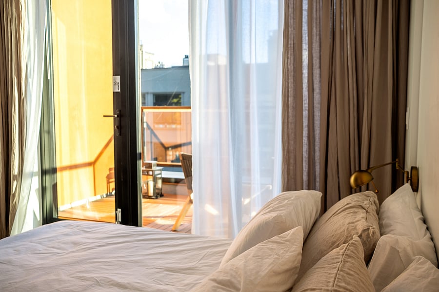 ALONK Suite with ensuite bathroom, private terrace, King bed, wardrobe and dedicated desk.