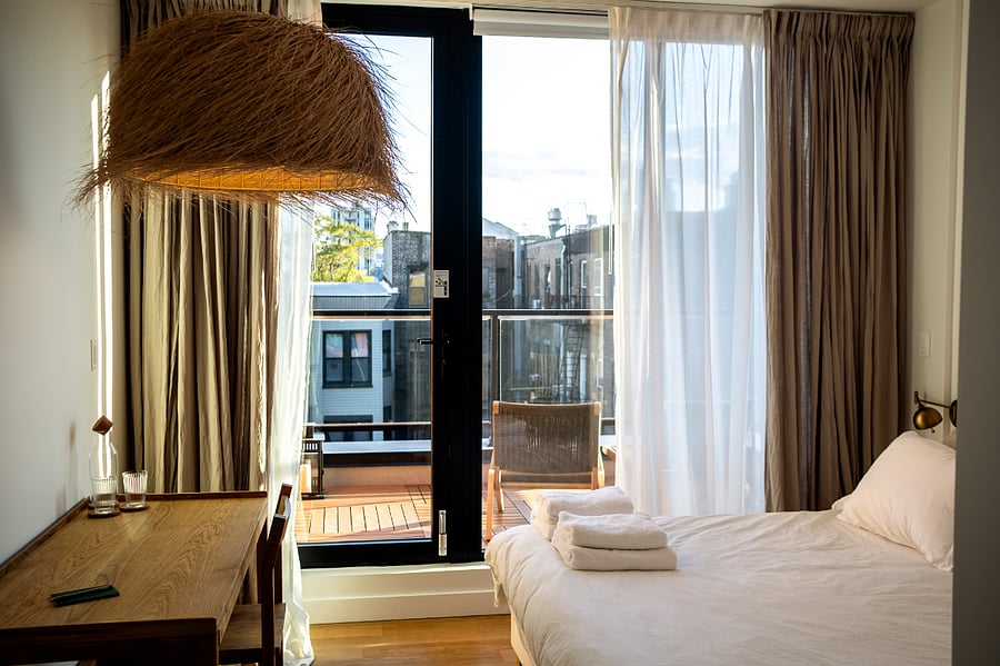 ALONK Suite with ensuite bathroom, private terrace, King bed, wardrobe and dedicated desk.