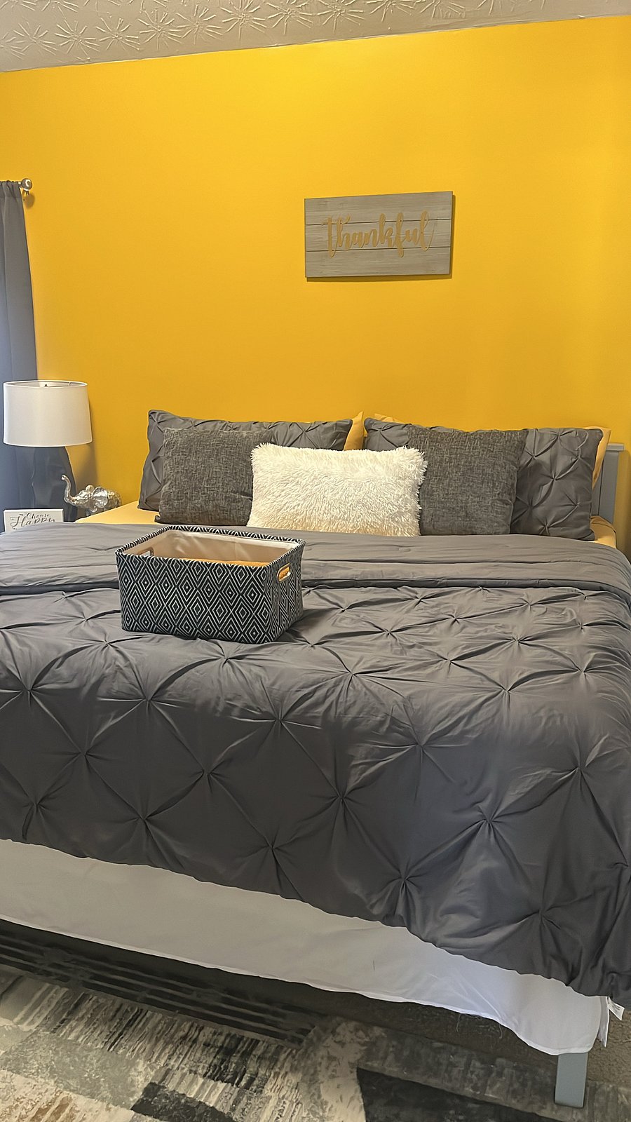 Guest bedroom-King sized bed, desk, smart TV, futon couch, laundry basket, ironing board, iron, dresser, towels & toiletries.