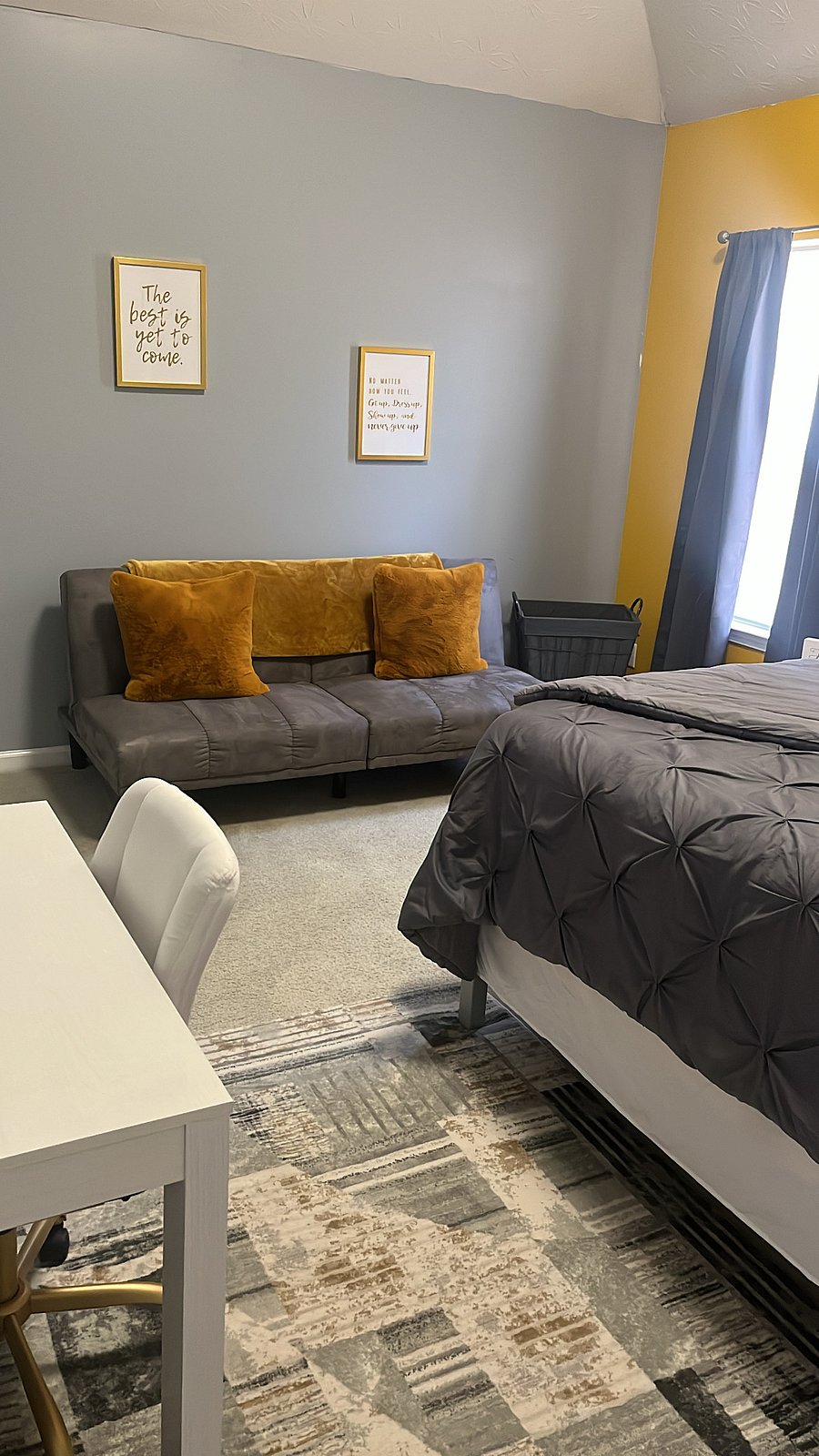 Guest bedroom-King sized bed, desk, smart TV, futon couch, laundry basket, ironing board, iron, dresser, towels & toiletries.