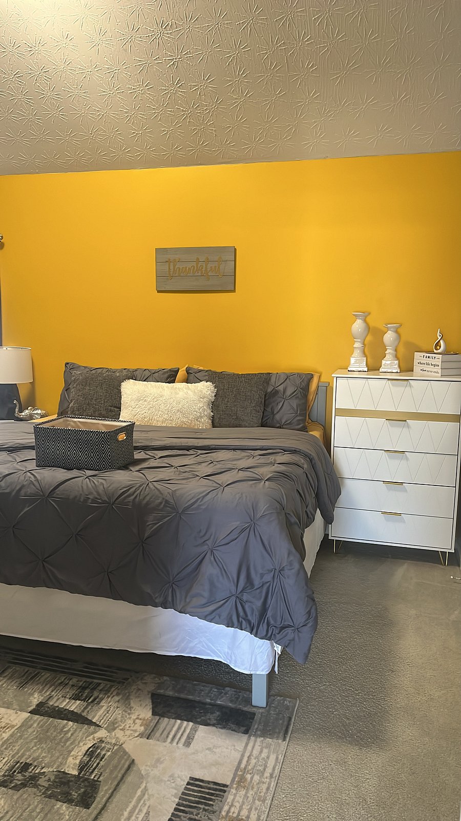 Guest bedroom-King sized bed, desk, smart TV, futon couch, laundry basket, ironing board, iron, dresser, towels & toiletries.