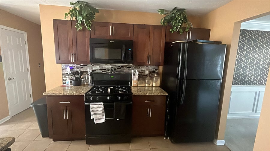 Kitchen with kitchen ware provided, pots/ pans, air fryer, pressure cooker, cooking utensils etc.