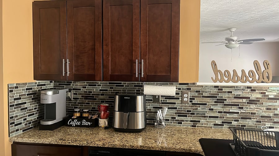 Kitchen with kitchen ware provided, pots/ pans, air fryer, pressure cooker, cooking utensils etc.