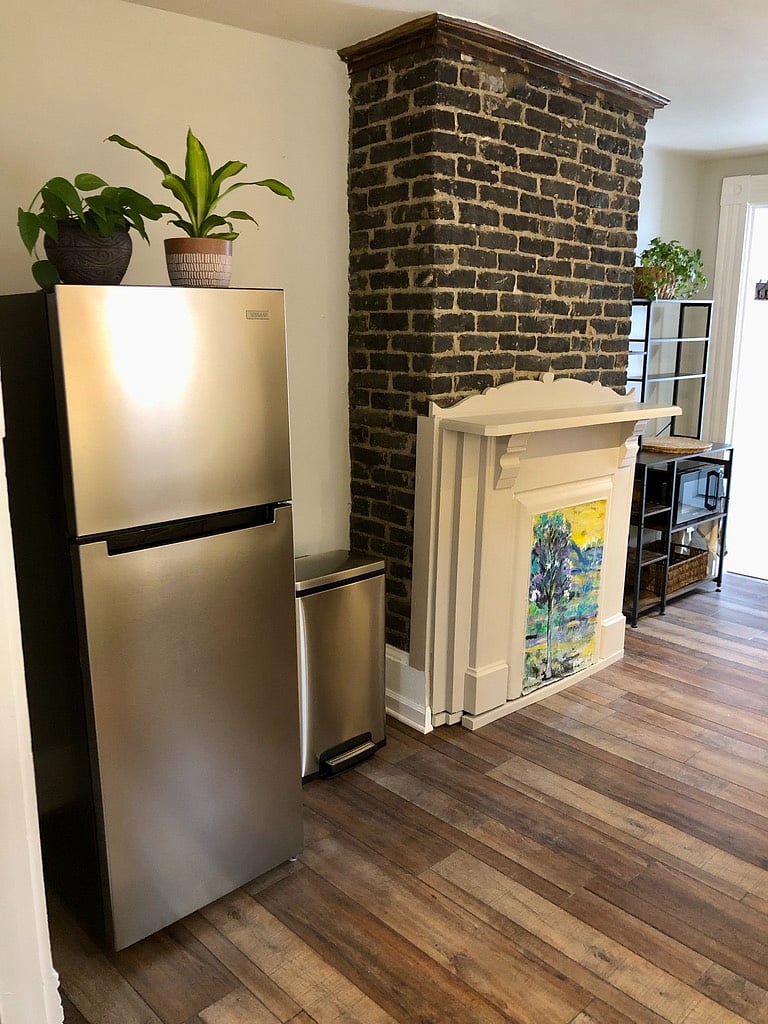 Brand new stainless fridge/freezer; baker's rack with microwave and coffee maker.
