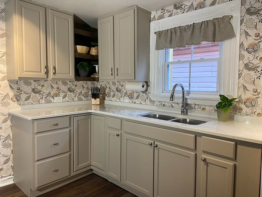 Quartz countertops, sparkling new sink and faucet, stainless stove backsplash, new lower cabinets. Fully stocked with dish ware, glassware, flatware, bakeware, pots and pans, cooking utensils.