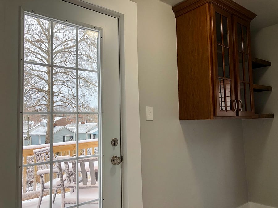 The laundry room exits to the deck and backyard, doubling as a convenient mudroom for shoes and coats.