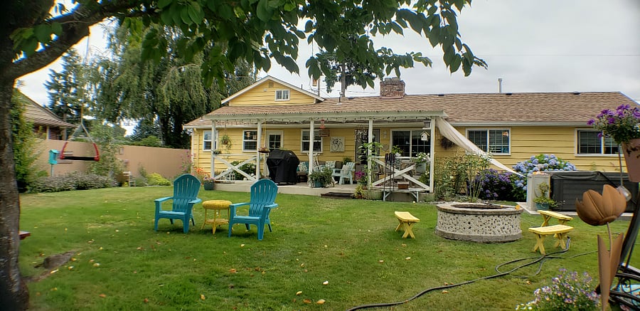 Looking from backyard to covered patio. Entrance door to unit is the door on the left.