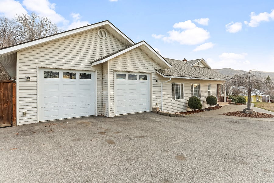 Large 4-car garage with parking and storage space included