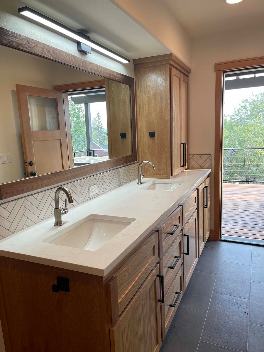 Primary suite bathroom with access to private deck and hot tub.
