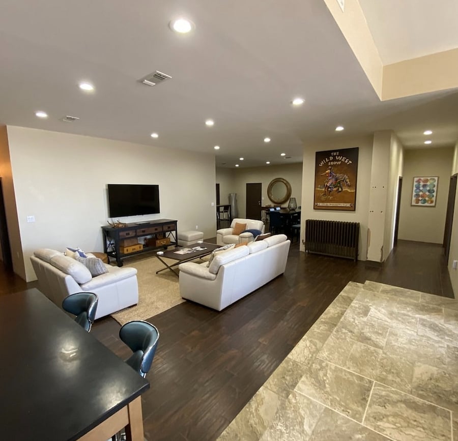 View from Kitchen.  Entrance to loft left of large round mirror, hallway to two bedrooms and shared bath on right. 
