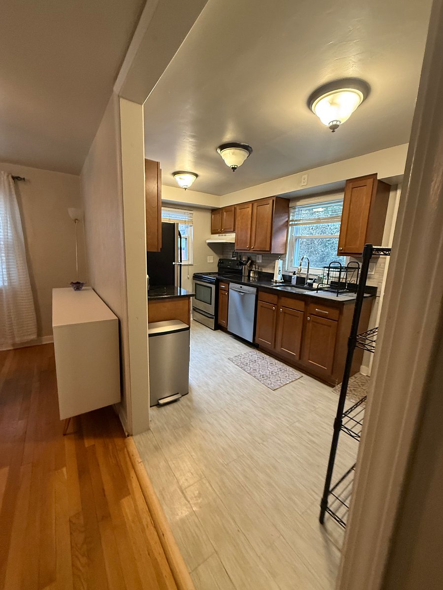 white buffet cabinet (dining room) and stainless steel trash bin