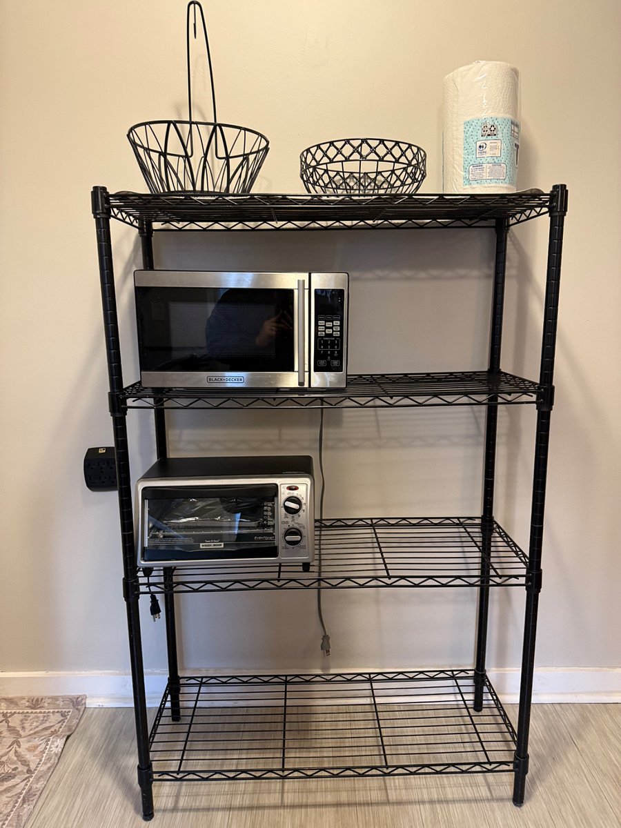 microwave, toaster oven, and fruit baskets above