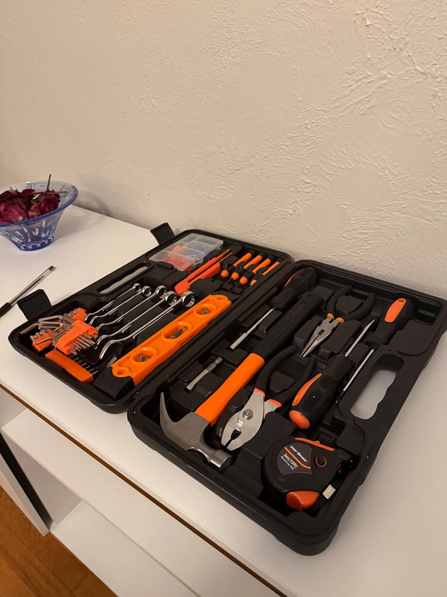 tool box, stored in the top shelf of the coat closet