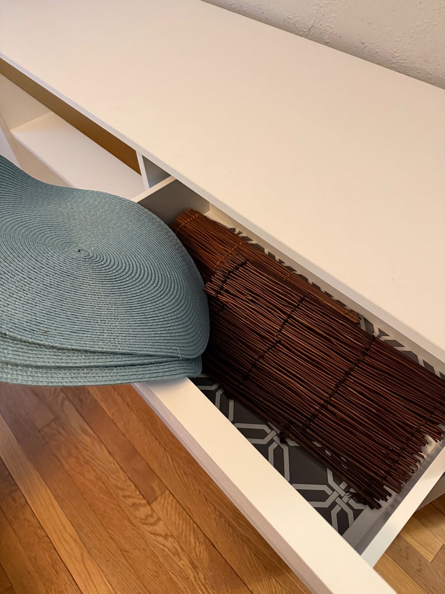 placemats stored in the buffet cabinet