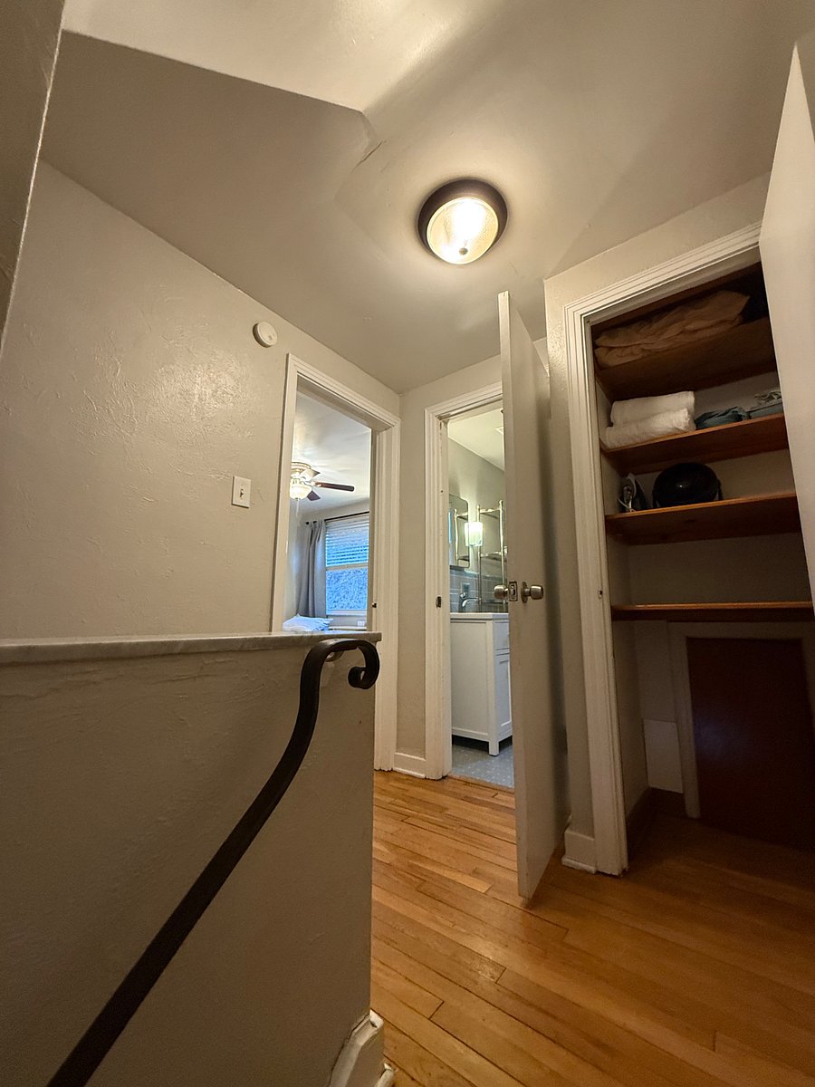 bedroom ONE pictured on the left
middle: full bathroom
right: hallway closet