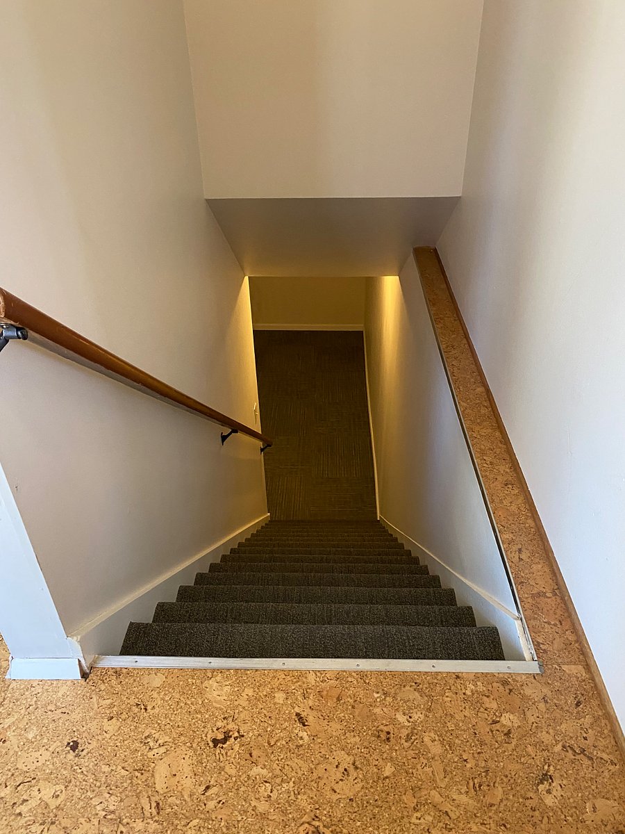 Stairs to basement. Share home entry -- front door or through garage