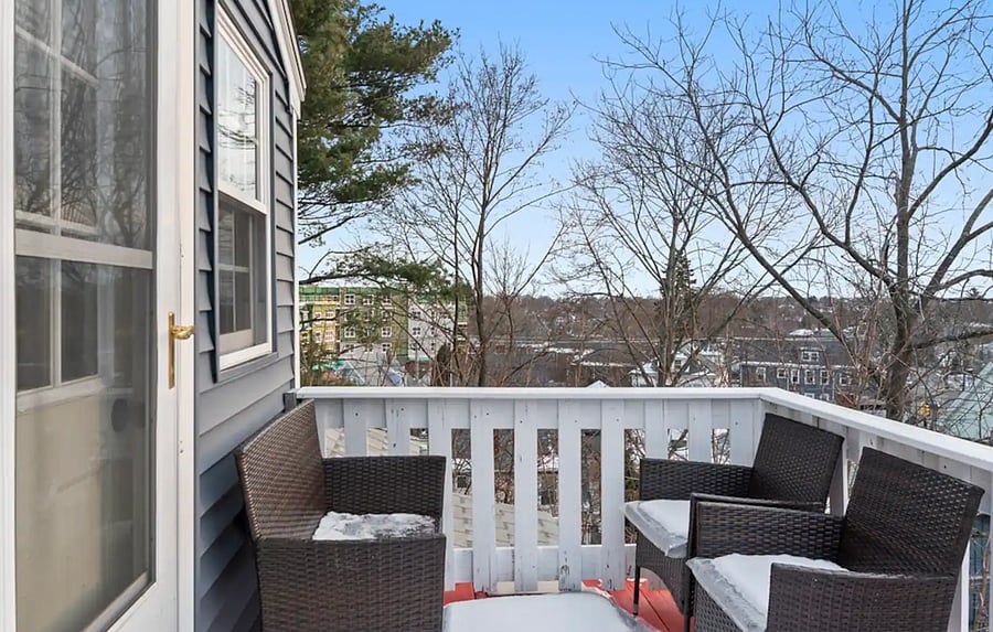The private balcony has plenty of seating with a view of the town, perfect for enjoying your morning coffee!