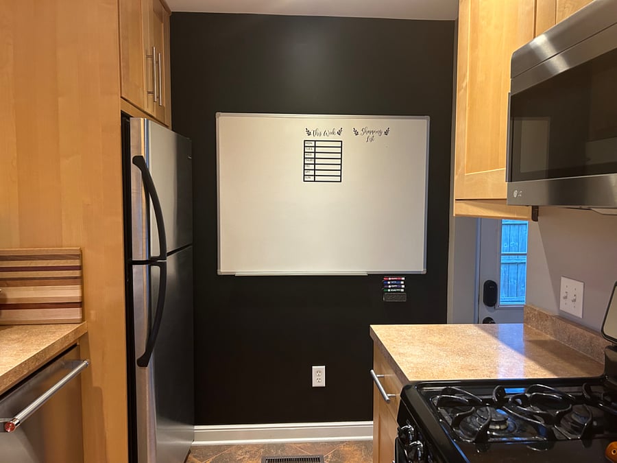 Chalk wall with a white board. Perfect for keeping track of your grocery list!