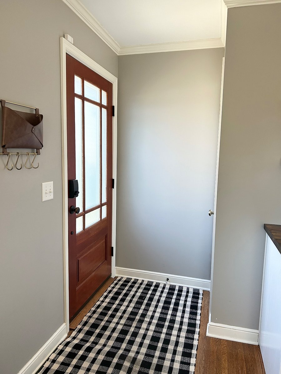 Front door entrance with a coat closet.