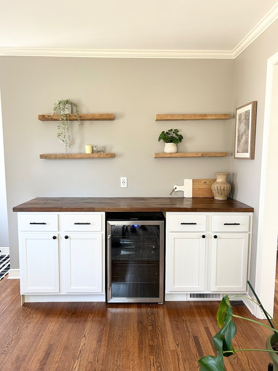 Living room custom built dry bar with mini fridge and extra storage space.