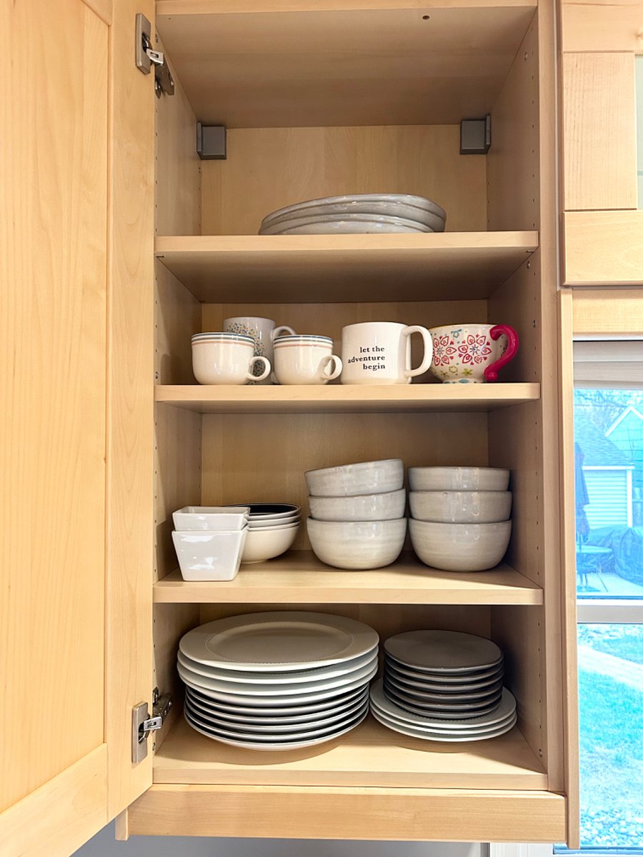 Fully stocked kitchen with plenty of plates, bowls, mugs, etc.
