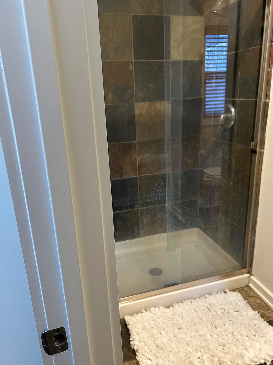 Dual shower heads-tile, stone tile. 