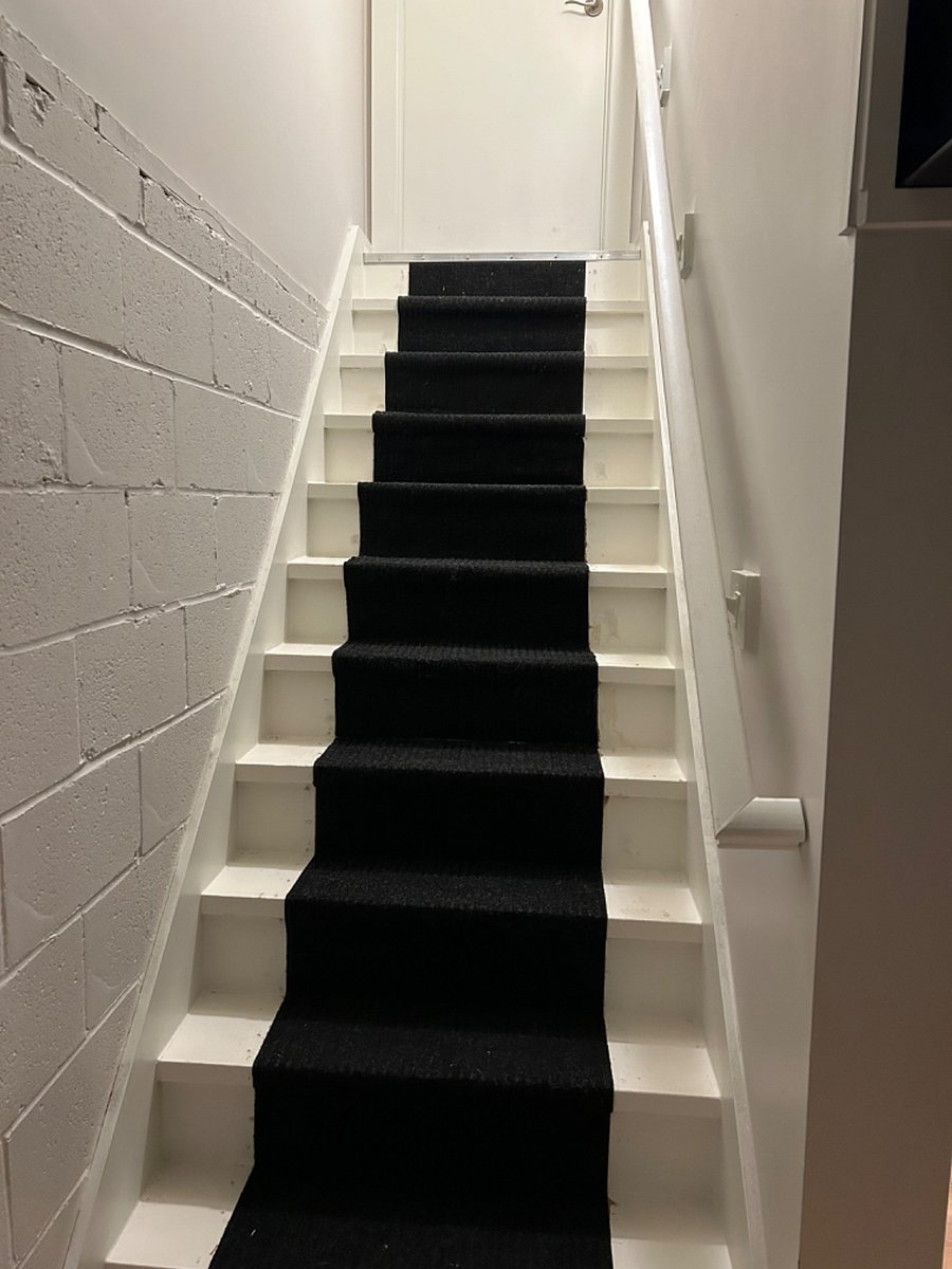 Stairway-Kitchen to Downstairs, Guest Suite- Bedroom, Full Bath, Computer Workstation. 40 TV, and Laundry. 