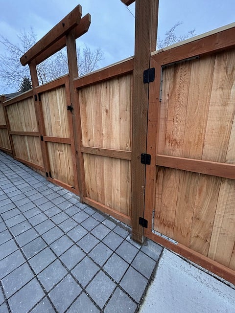 Fenced area backing up to cottage