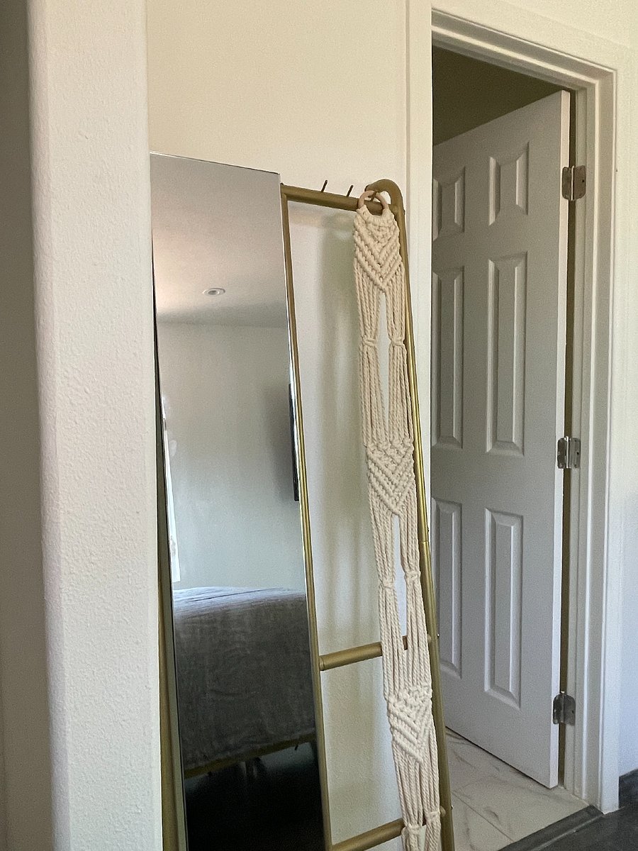 View from the bed towards the bathroom entrance