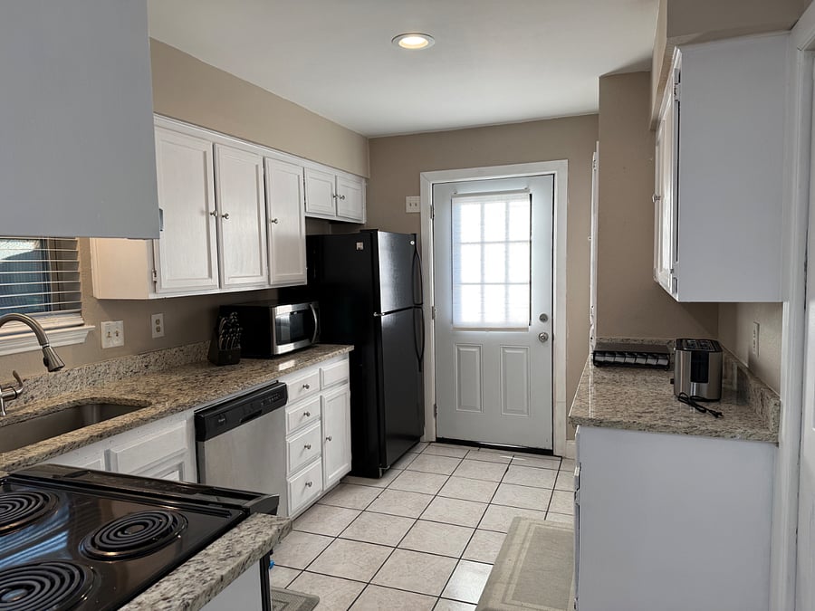Kitchen and backdoor after entering through carport
