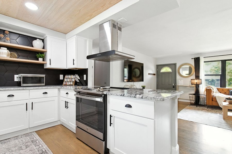 Full size electric range and small microwave.