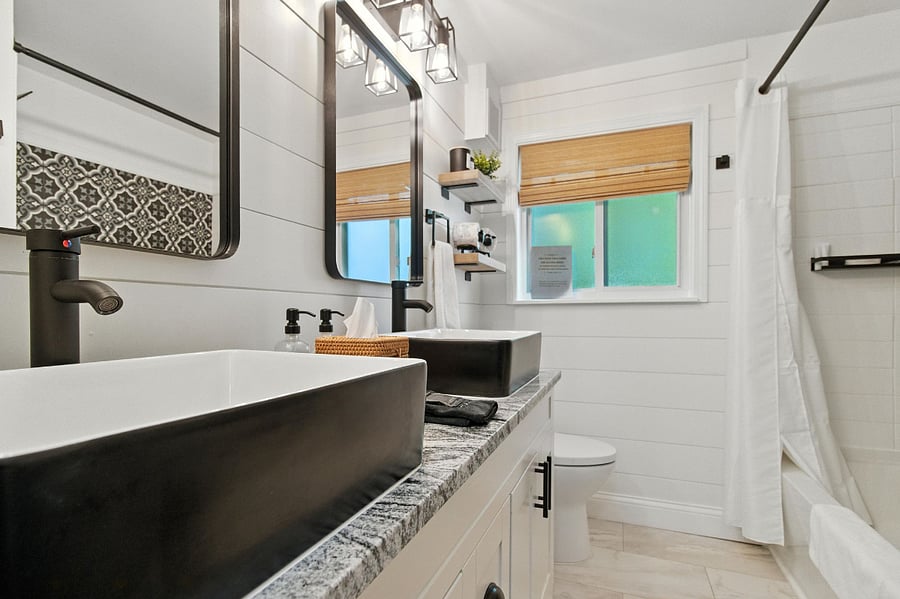 Full bath with double sinks near the three bedrooms.