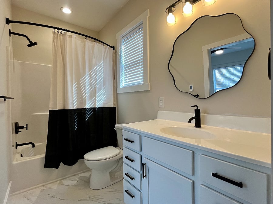 Pink House heated bathroom floors, tub and shower combo