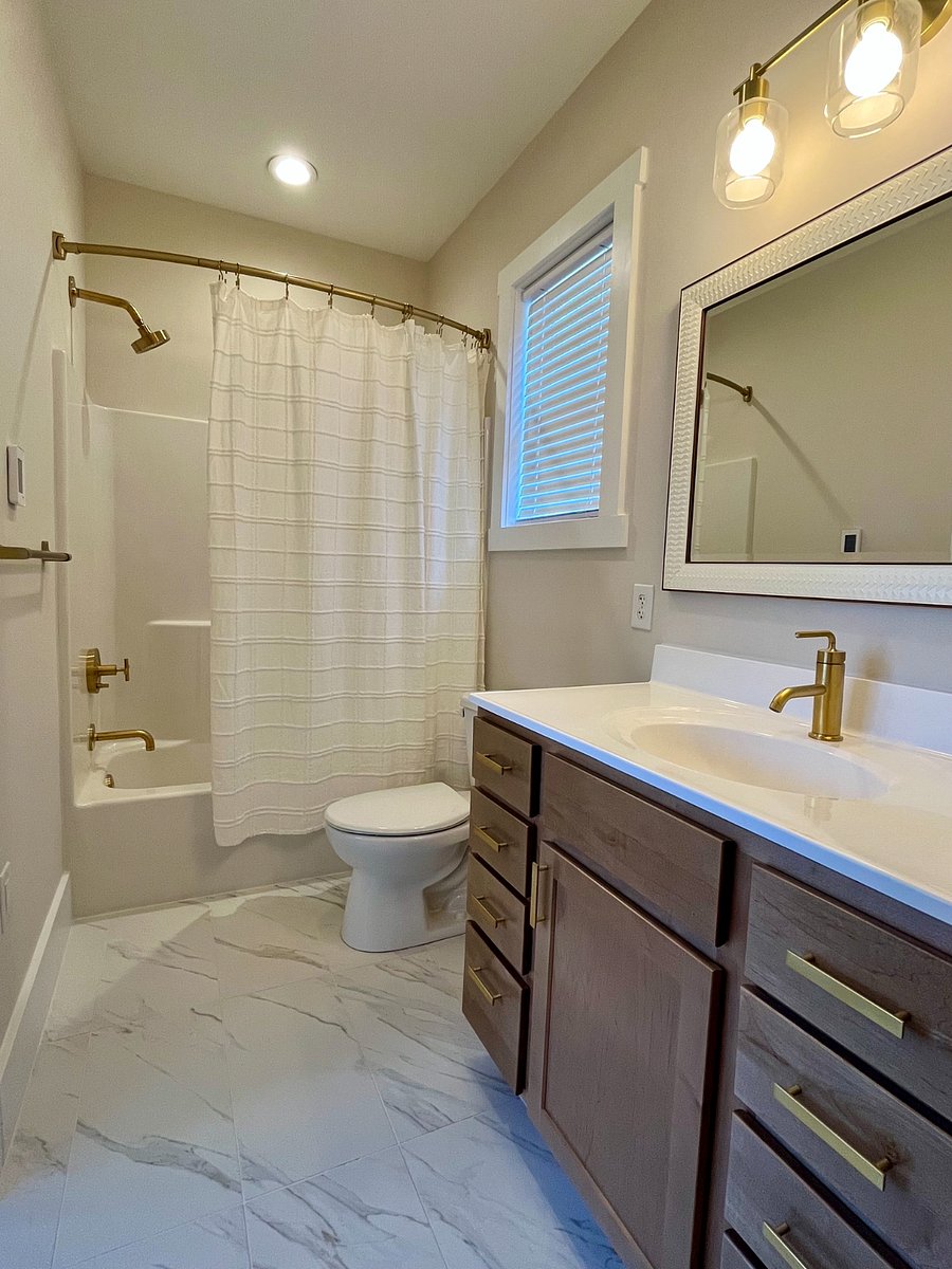 Yellow House heated bathroom floors, tub and shower combo