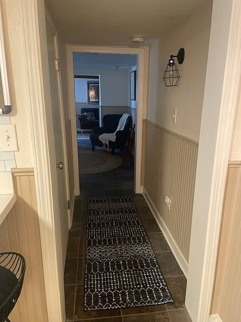 Enjoy seamless flow between the kitchen and bedroom through a short hallway that also grants access to the full bathroom.