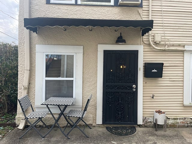 Enjoy a private, covered entrance with cozy seating and ample lighting for added comfort and security.