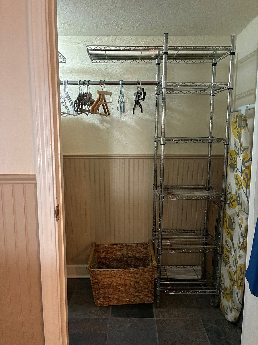 Spacious walk-in closet equipped with ample hanging space, built-in shelving, and all the essentials youll need for a comfortable stay.