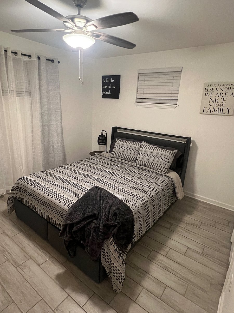 Bedroom 1, queen size bed with linen, USB charging port and LED lights in headboard