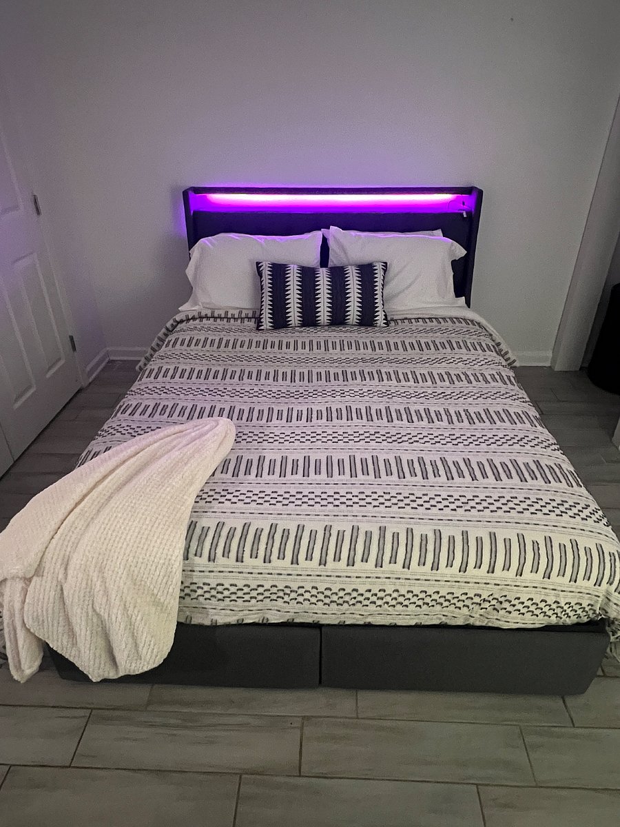 Bedroom 3, queen size bed with linen, USB charging port and LED lights in headboard