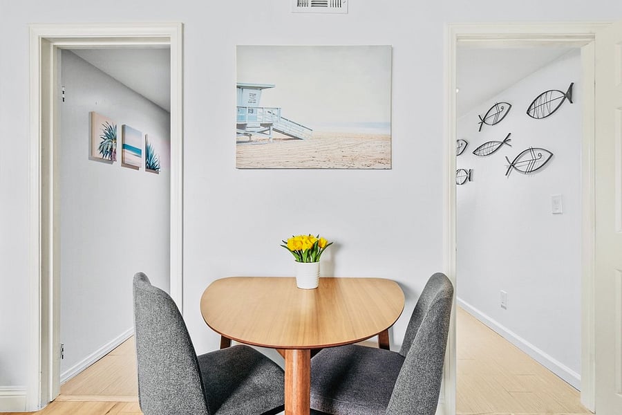 Dining Set close to Kitchen. Door to Common Area & Laundry.