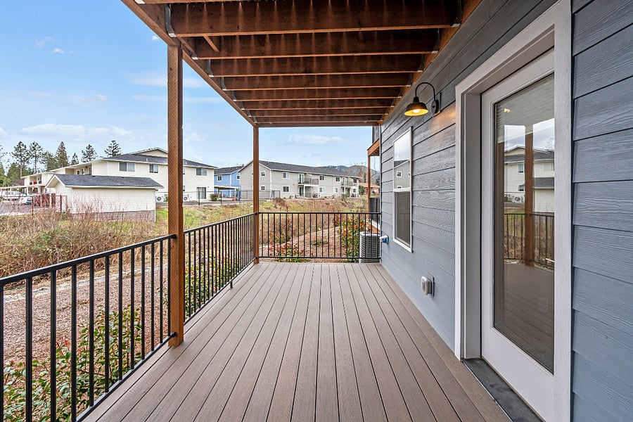 Two large outdoor decks facing creek and mountain views