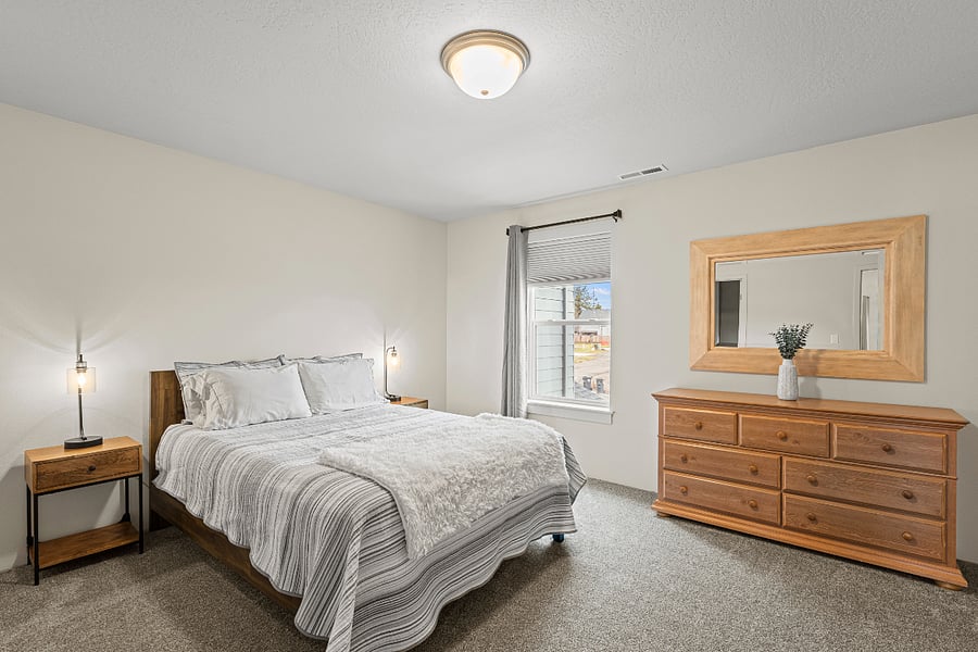 Master bedroom with queen bed and attached full sized bathroom